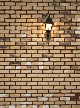 Electric lantern in old style on a wallの写真素材