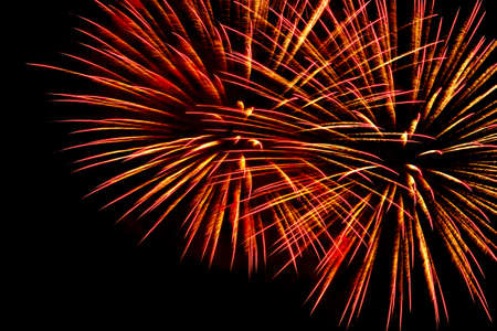 Two bright flashes of salute against the night sky