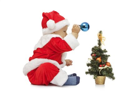 The beautiful little boy in suit of Santa Claus Isolated on white backgroundの写真素材