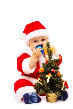 The little baby boy with New Year's toys in handsの写真素材