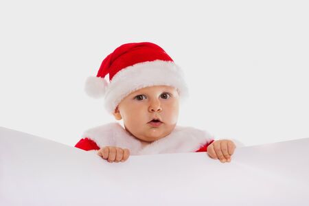Small Santa Claus with the poster ti is isolatedの写真素材