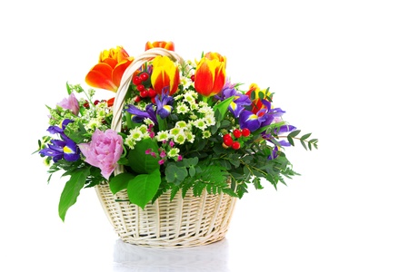 Bunch of flowers in basket isolated on white backgroundの写真素材