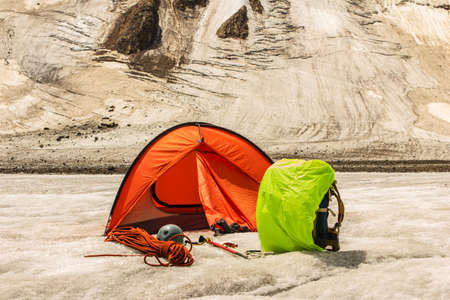 Highly in mountains there is tent of climbersの写真素材