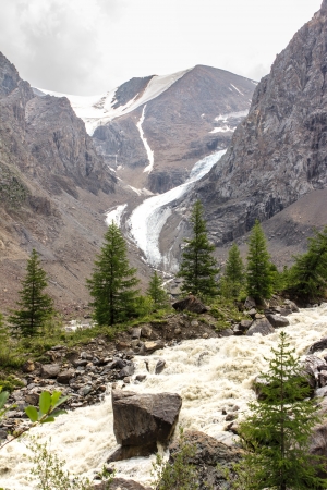 Beautiful landscape with the muddy river in mountains summerの写真素材