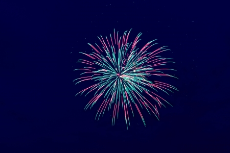 Brightly colorful fireworks and salute of various colors in the night skyの写真素材