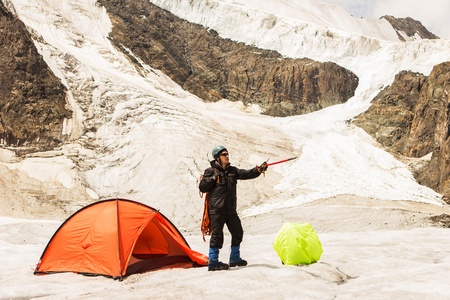 The climber specifies by hand towards the forthcoming routeの写真素材