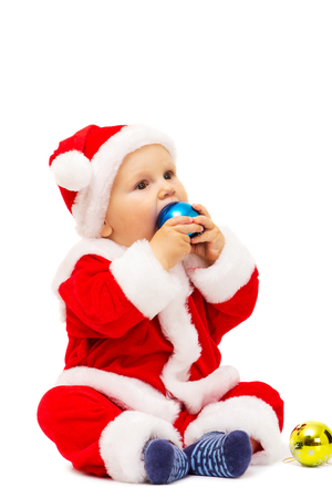 The boy in dress of Santa Claus it is isolated on white backgroundの写真素材