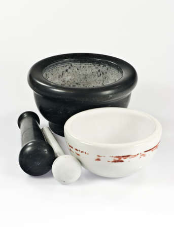 Two mortars with pestles on white backgroundの写真素材