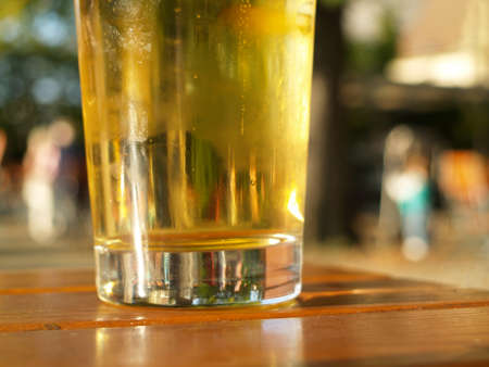 a filled glass with cold beerの写真素材