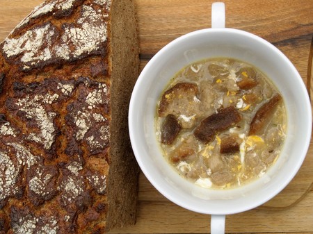 Bread soup in soup bowl with breadの写真素材