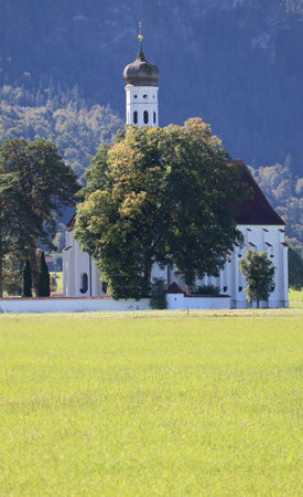 picturesque Pilgrimage church with fenced-in Pasture area