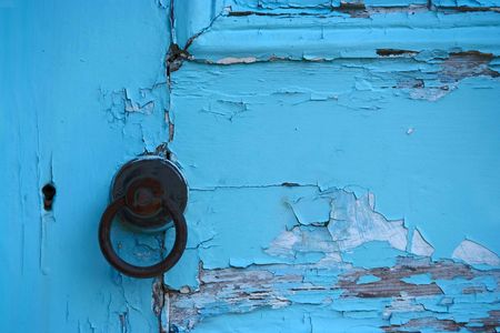 Paint peeling from an old door. Turquoise colour.の写真素材
