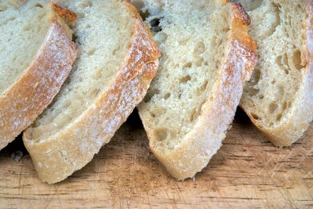 Slices of Stone-ground bread on a chopping board
