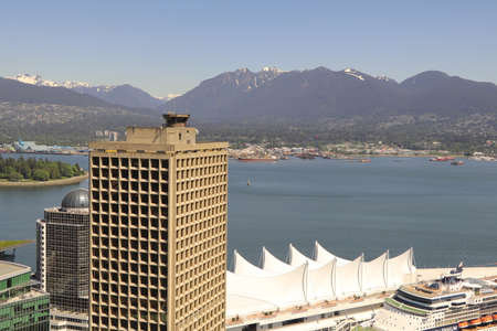 Amazing view over the beautiful skyline of Vancouver in British Columbia in the beautiful country Canada. Wonderful clear day with a sunny day and a blue sky.のeditorial素材
