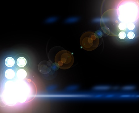 Stadium lights against dark night sky backgroundの写真素材