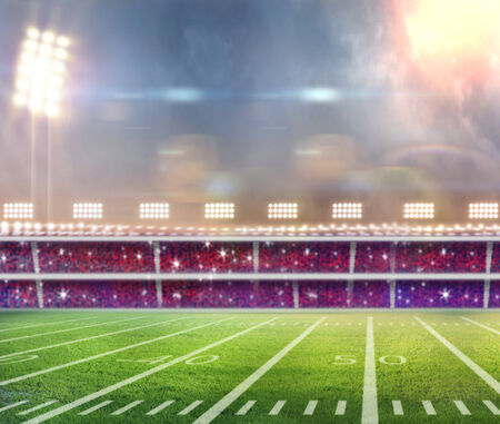 Green soccer field, row of bright spotlights, illuminated stadium in nightの写真素材