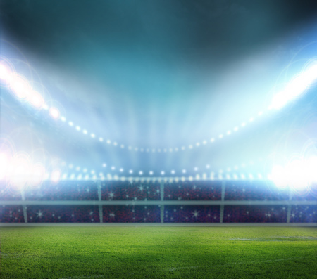 Green soccer stadium, illuminated field, arena in nightの写真素材