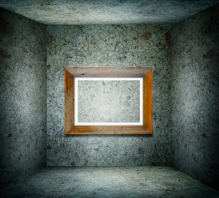 Old room with empty picture frameの写真素材
