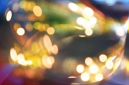 Festive winter gold abstract. background with bokeh lights and starsの写真素材