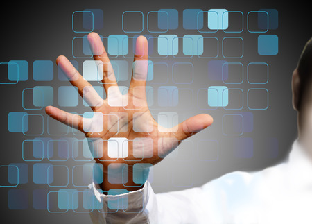 hand pushing on a touch screen interface