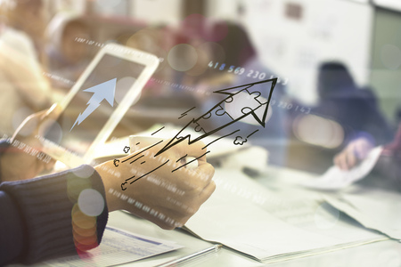 business documents on office table with smart phone and digital tabletの写真素材
