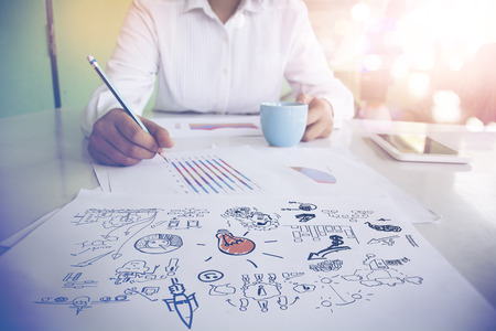 Image of male hand pointing at business document during discussion at meetingの写真素材