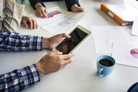Businessman making presentation with his colleagues and business tablet digital computer at the office as conceptの写真素材