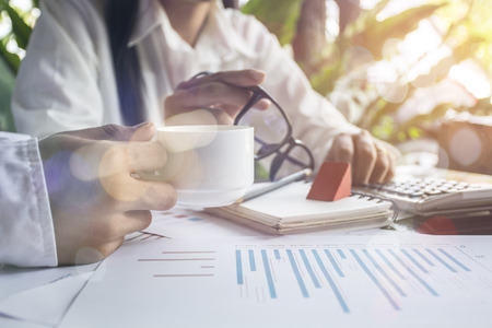 Close-up shot of an analytical team working with the latest financial results, Office life concept.の写真素材