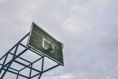 Cyan old wooden basketball hoop with natural lens flareの写真素材