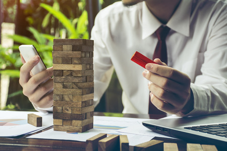 business  hand stop dominoes continuous toppled or risk with copyspaceの写真素材