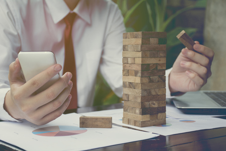 business  hand stop dominoes continuous toppled or risk with copyspaceの写真素材