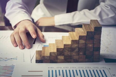 Businessman Building Up Tower Challenge In Business Conceptの写真素材