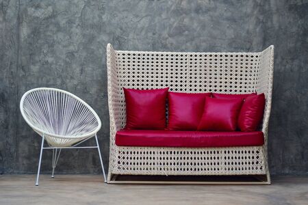Red leather sofa with pillow. Red Divanの写真素材