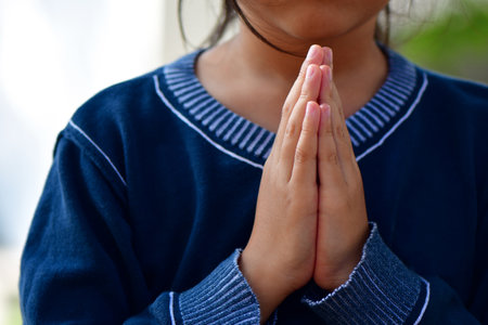 Little asian girl praying and worship to GOD in the morning. Little asian girl hand praying,の写真素材