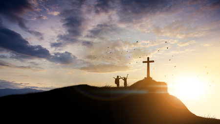 Family worship concept: a family at the Cross of Jesus.の写真素材