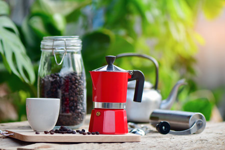 Moka pots, coffee maker with coffee cup and coffee beans on wooden table,の写真素材