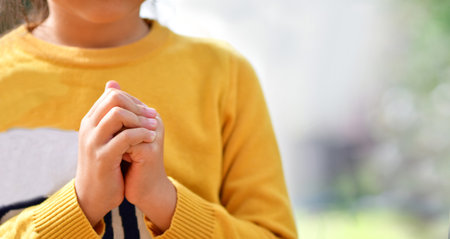 Little asian girl praying and worship to GOD in the morning. Little asian girl hand praying,の写真素材