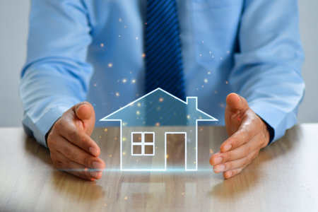 real estate, home insurance and happiness concept - close up of female hands holding white house icon.の写真素材