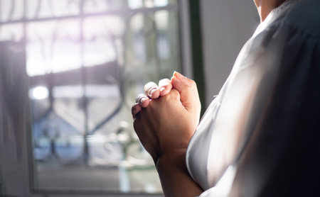 Close up of woman Woman hands praying and thankful. love and care, spray or visualize. Religion, faith concept.の写真素材