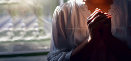 Close up of woman Woman hands praying and thankful. love and care, spray or visualize. Religion, faith concept.の写真素材