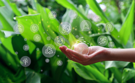 Business holding world and icon to Organization Sustainable development environmental. business responsible environmental,の写真素材