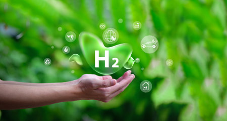 Human hand with the word H2 on a green background. H2 hydrogen innovation zero emissions technology.の写真素材