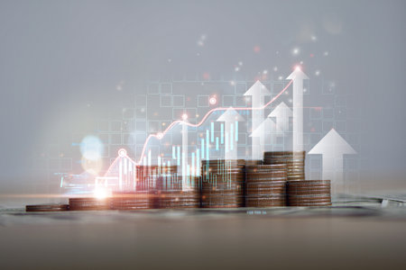 Coin stack with growth chart and graph progress , Stack of silver coins with trading chart in financial concepts and financial investment business stock growthの写真素材