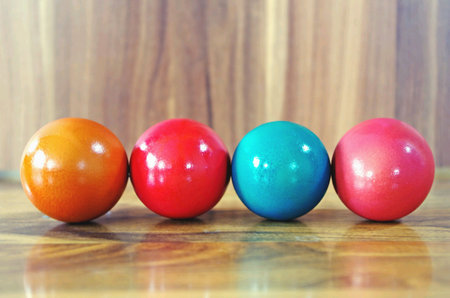 Colorful of easter eggs on wooden backgroundの素材