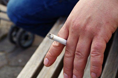 man smoking a cigaretteの写真素材
