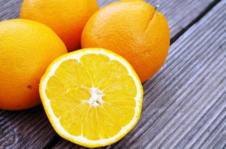 Fresh organic orange on wooden backgroundの写真素材