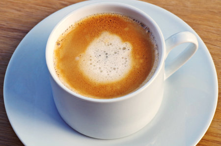 Cup of coffee on a served table. Hot drinks for breakfast.の写真素材