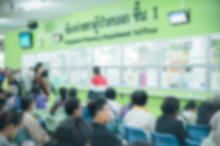 Patients waiting treatment in the waiting area at the hospital blurred.の写真素材