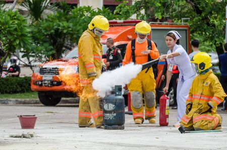 Thailand : July 30, 2019 : Peoples preparedness for fire drill and training to use a fire safety tank in the hospital. Udon Thani, Thailand.のeditorial素材