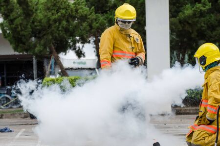 Thailand : July 30, 2019 : Peoples preparedness for fire drill and training to use a fire safety tank in the hospital. Udon Thani, Thailand.のeditorial素材